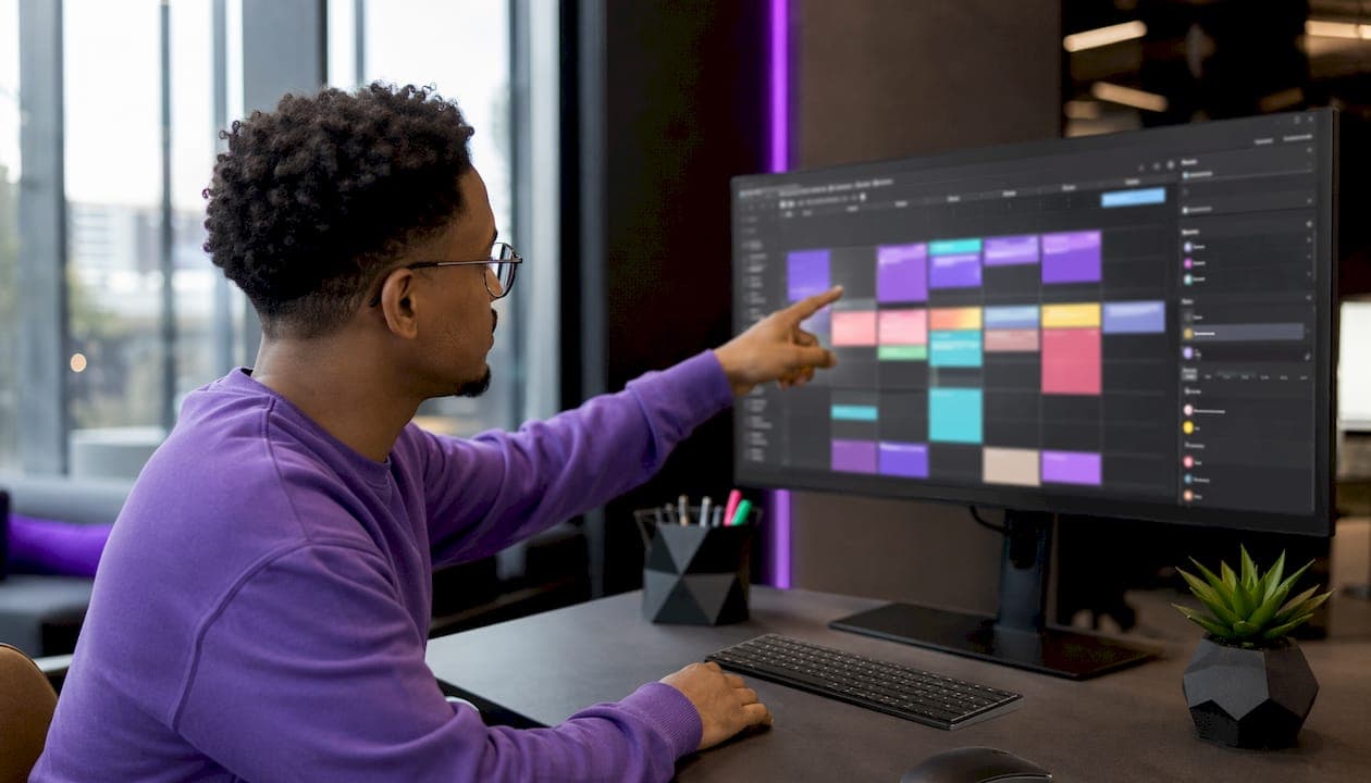 Team member managing digital video scheduling